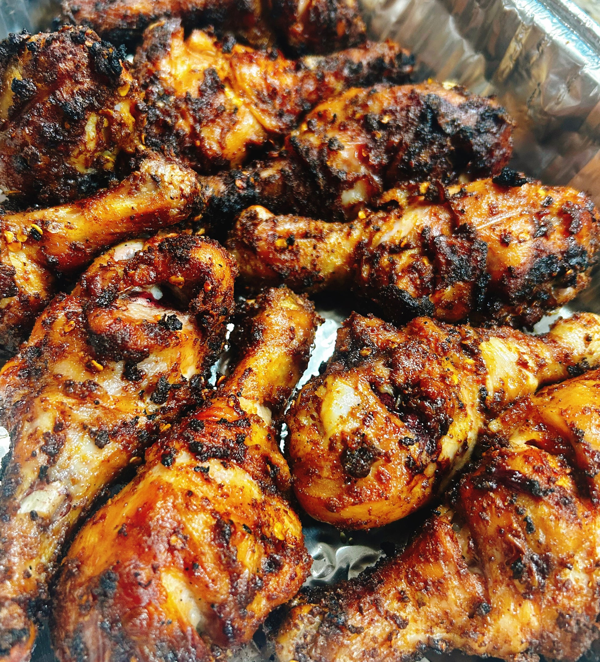Tray of Suya Chicken drumsticks.